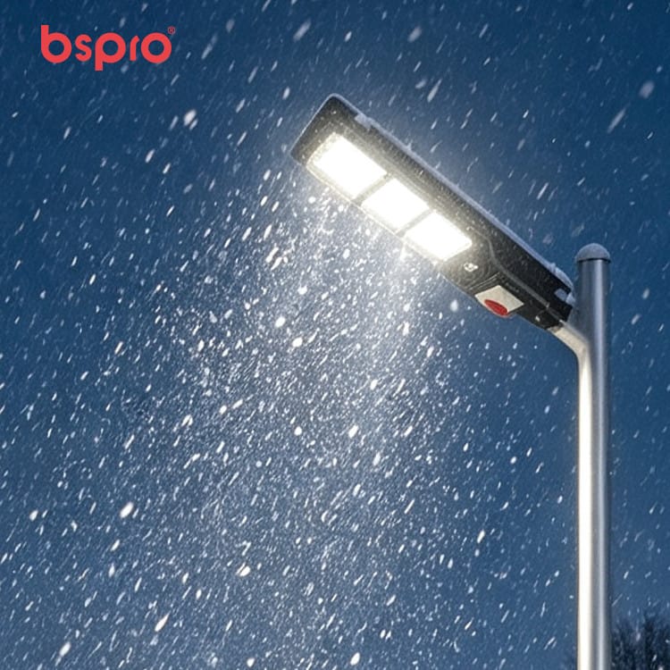 Streetlight illuminated in falling snow
