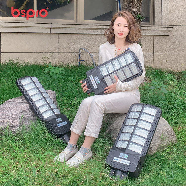 Woman holding large LED lights