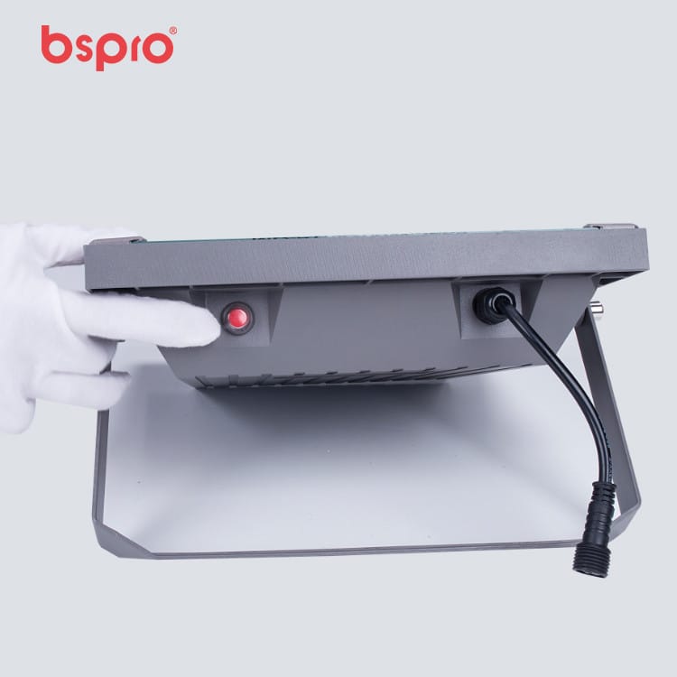 Hand holding a device with button
