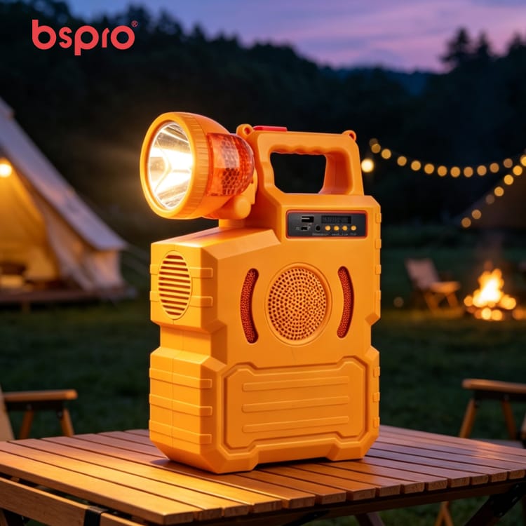 Orange portable speaker with flashlight